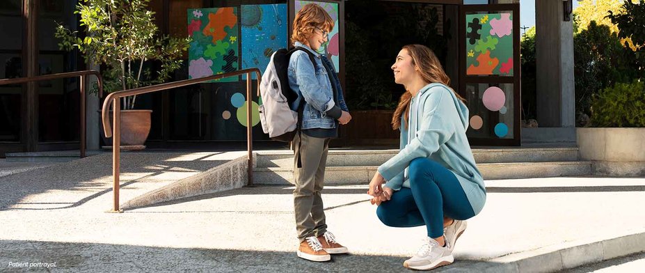 Mom dropping son off at school