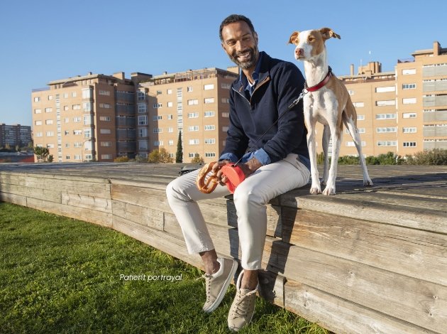 A man smiling with his dog
